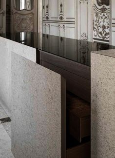 an image of a bathroom setting with marble counter tops and cabinets in the back ground