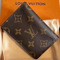 Louis Vuitton Monogram Bifold Wallet / Card Holder Bnib Classic Wallet In Monogram Canvas With Original Box, Monogram Canvas Wallet With Original Box For Everyday Use, Designer Monogram Canvas Wallets For Business, Classic Monogram Canvas Wallet, Artisan Brown Bifold Card Holder, Monogram Canvas Wallets With Card Slots, Luxury Wallet In Monogram Canvas, Designer Brown Bifold Card Holder, Brown Monogram Canvas Bifold Wallet