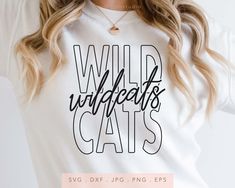 a woman wearing a t - shirt with the words wild wildcats cats printed on it