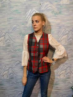 "Vintage Plaid Vest Black Red Checkered Lana VirginWool Vest Size Medium Fitted Waistcoat Plaid Student Vest School Girl Vest Label size: M Measurements: (lying flat) Length - 23,5\" / 60 cm Pit to pit: 18\" / 46 cm Waist - 16\" / 41 cm Please check measurements to insure a proper fit. Remember to allow yourself some extra room for movement. You can compare these with something from your closet that fits you well. This vest will come to you freshly laundered and ready to wear. Please feel free c Fitted Waistcoat, Girls Vest, Red Checkered, Plaid Vest, Long Vests, Wool Vest, Vest Outfits, Cool Jackets, Vintage Plaid