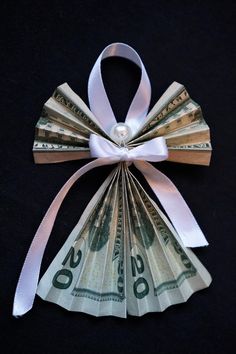 an origami bow made out of money