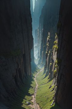 a train traveling through a valley surrounded by tall rocks and green grass on the side