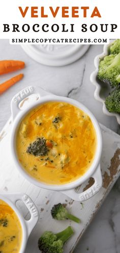 two bowls of broccoli soup with carrots and celery on the side