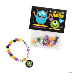 the beaded bracelet has two monsters on it and is packaged in a plastic bag