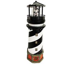 a black and white lighthouse with a light house on top