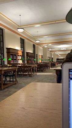 an empty library with tables and chairs in it