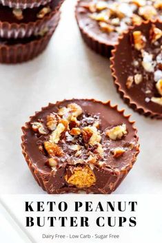 chocolate cupcakes with nuts on top and the words keto peanut butter cups above them