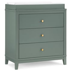 a baby changing table with three drawers and gold knobs on the bottom, in grey