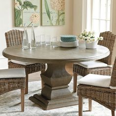 a dining room table with leopard print chairs and a tray on it's center