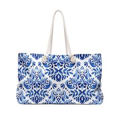 "Watercolor Blue Sicilian Tiles Large Tote Bag, Blue Floral Tote Bag, Blue Tile Pattern Print Bag, Blue Summer Beach Bag ---- Our oversized Weekender Tote is ideal for a weekend at the beach or in town. The wide-mouthed, durable bag holds a generous amount of personal items and is easily held by its thick rope handles. .: 100% Spun Polyester .: T-bottom .: Cream sheeting interior lining .: One size: 24\" x13\" (60.9 cm x 33 cm) .: Print in the USA CARE INSTRUCTION: Suggested to pretreat visible Blue Large Capacity Canvas Bag For Daily Use, Blue Weekender Bag With Removable Pouch For Travel, Blue Large Capacity Shoulder Travel Bag, Large Capacity Blue Shoulder Travel Bag, Blue Shoulder Bag For Travel, Blue Rectangular Shoulder Bag With Large Capacity, Blue Travel Bag For Daily Use, Large Capacity Blue Bag For Travel, Large Capacity Blue Rectangular Shoulder Bag