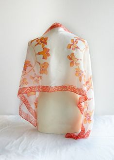 White kimono scarf with Freesia orange and coral flowers was hand painted on pure silk. How about a gift for your gardener friend? Size: 61 by 17 inch (155 by 43 cm) Silk: 100% natural Habotai Light (semi-transparent, delicate and a bit glossy), hand painted with silk paints that won't fade in the sun. The design is visible on both sides. This silk scarf was designed as my impression over Japanese kimono silk painting art. The color composition is simple and refreshing. You can see orange flower White Silk Scarf With Floral Print For Gift, White Floral Print Silk Scarf As A Gift, White Floral Print Silk Scarf For Gift, Orange Silk Scarf For Summer Gift, White Hand Painted Silk Scarf Gift, Handmade White Silk Scarves, White Scarf As Spring Gift, Elegant Orange Silk Scarf As Gift, Elegant Orange Silk Scarf For Gift