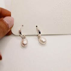 Give your ears a comfy hug from these Freshwater Pearl Huggie, cute and stylish earrings that come with the removable charm of White or Grey Pearls. Customers have a choice of choosing Sterling Silver or Goldfilled body. These small yet elegant earrings add an aesthetic touch to any contemporary outwear. Material: gold filled, Grey or White Fresh Water Pearls Length: 13mm Huggies + approx. 10-12mm Pearls Handmade in the USA Stylish Earrings, Fresh Water Pearls, An Aesthetic, Stylish Earring, Water Pearls, Pearl Charms, Pearl Grey, Elegant Earrings, Fresh Water