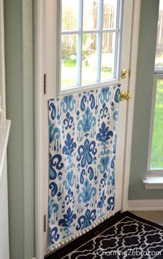 the door is decorated with blue and white fabric, which matches the wall color scheme