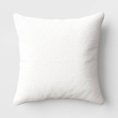 a white pillow on a gray background