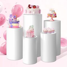 there are many cakes and cupcakes on top of these cylinders with balloons in the background