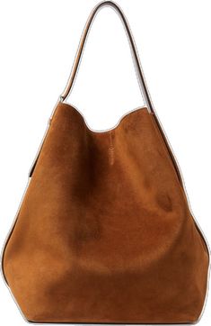 a brown suede handbag on a white background