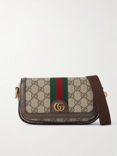 It's hard to deny the timeless appeal of Gucci's 'Ophidia' series, and this mini shoulder bag is a fine example. Crafted in Italy from signature coated-canvas, it's mapped with the house's unmistakable 'GG' monogram, first unveiled in the '30s, and finished with smart leather trims. The compact size fits your phone, wallet and keys. Gucci Crossbody Bag Outfit, Crossbody Bag Outfit, Shop Gucci, Purses Vintage, Gucci Crossbody Bag, Gucci Purses, Gucci Ophidia, Gucci Crossbody, Flat Dress Shoes