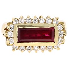 This ring has a straight Baguette Cut Ruby that weighs 2.56 Carats and 20 Round Cut Diamonds that weigh 0.58 Carats with a clarity and color of VS-F. The ring is casted in 18K Yellow Gold and weighs approximately 10.0 grams. The setting has a Art-Deco Inspired feel with its use of a straight and stunning Baguette Cut Ruby. It is a size 7 1/4 and can be re-sized at no additional cost. Ruby Diamond, Baguette Cut, Art Deco Inspired, Inspiration Art, Round Cut Diamond, Yellow Gold Rings, Band Rings, Modern Furniture, Heart Ring