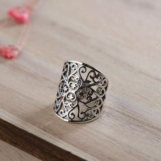 Discover the perfect blend of luxury and versatility with our Adjustable Sterling Silver Filigree Ring. Meticulously crafted with a detailed, vintage-inspired wide band, this ring boasts an intricate pattern of scrollwork and floral motifs that exude timeless sophistication. The beauty of this piece lies in its flexibility; designed to comfortably fit any finger, the adjustable band ensures a custom fit without compromising on style. This exquisite ring is a testament to artisan skill, with each openwork detail carefully etched into high-quality sterling silver, offering a durable and lasting shine. Ideal for those who value elegance and adaptability, it makes a stylish statement piece for daily wear or special events. Packaged with care, this adjustable silver ring is a thoughtful gift fo Bohemian Filigree Ring For Anniversary, Unique Adjustable Filigree Ring With Intricate Design, Bohemian Open Filigree Ring With Intricate Design, Bohemian Filigree Open Ring With Intricate Design, Ring Inspiration, Filigree Pattern, Pattern Ring, Gifts Fo, Wide Rings