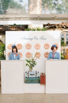 there are two people standing behind the counter at this wedding reception with clocks on the wall