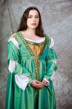 This renaissance dress consists of four  parts: kirtle, laced at the back, overdress, chemise and detachable sleeves. This dress is made in taffeta. Could be in silk (additional fabric cost), wool or cotton. Custom sized to your measurements. Please send me bust, waist, hip and length measurements after the order has been completed. Can be shipped in other countries, please feel free to ask. There are a lot of different historical dresses and costumes in my shop, feel free to visit under https:/ Fitted Princess Style Medieval Dress For Fantasy Events, Fitted Medieval Princess Dress For Fantasy Events, Medieval Costume Dress With Fitted Bodice, Fitted Green Dress For Medieval Festivals, Overbust Medieval Dress With Historical Design, Westeros Fashion, Black Leather Jacket Outfit, Victorian Wedding Dress, Victorian Corset