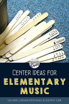 the center ideas for elementary music are made with wooden clothes pins and an empty cup