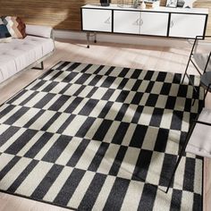 a black and white checkered rug in a living room