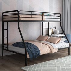 a black metal bunk bed sitting on top of a wooden floor