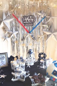 a star wars themed birthday party with desserts and decorations