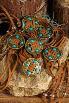 Expertly crafted with a chestnut western design and embellished with turquoise accents, this layered string tassel belt adds a touch of Southwestern charm to any outfit. Made with high-quality materials, it provides both style and function for a unique and fashionable look. Bohemian Bolo Ties For Western-themed Events, Southwestern Brown Fringe Jewelry, Bohemian Concho Bolo Ties For Rodeo, Bohemian Bolo Tie With Concho, Beaded Hat Bands, Western Turquoise, Tassel Belt, Turquoise Decor, Hat Bands