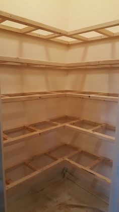 an unfinished shelving unit is shown in the process of being built