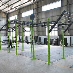 the inside of a building with multiple metal racks and benches in front of it,