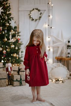 This dress combines the rich and luxurious feel of red velvet with a classic holiday pattern. It's a perfect blend of elegance and festive charm. The red velvet adds a touch of luxury to the dress. It's soft, warm, and has a delightful sheen that's perfect for special occasions. A design, in festive holiday colors, adds a cozy and traditional feel to the dress. Go back to the full catalogue here: https://www.etsy.com/shop/WeddingBabySlovakia?ref=profile_header Holiday Red Velvet Dress, Red Velvet Dress For Winter, Red Velvet Holiday Dress, Red Velvet Winter Dress, Christmas Mini Outfit Ideas, Baby Girl Holiday Dress, Elegant Christmas Outfit, Christmas Red Dress, Christmas Dress Toddler