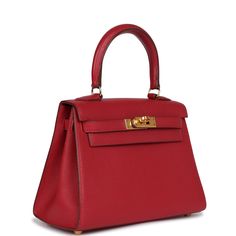 This Vintage Kelly, in the Sellier style, is in Rouge Vif Courchevel leather with gold hardware and has tonal stitching, two front straps with front toggle closure, single rolled handle and removable shoulder strap.The interior is lined with Rouge Vif chevre leather and has one open pocket on the back wall.Collection: B SquareOrigin: France Condition: Vintage; Excellent to Mint - The bag retains its structure. Visible scratches to the hardware and more moderate scratching to the hardware feet and turnlock. The exterior leather is clean but has a scratch to the front leather. The interior leather has some minor scuffing to the interior base but otherwise clean.Accompanied by: removable shoulder strapMeasurements: 7.5" x 5.5" x 3.25"; 3.5" (strap 16.5") Hermes Sellier, Hermes Kelly Sellier, Kelly Sellier, Vintage Kelly, Hermes Birkin 25, Hermes Constance, Vintage Hermes, Burberry Shoes, Birkin 25