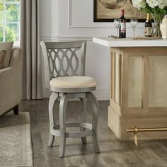 a bar stool sitting next to a counter in a living room