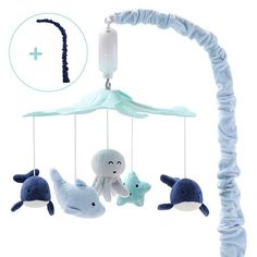 a baby crib mobile with stuffed animals hanging from it