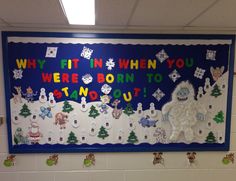 a bulletin board with snowmen and christmas trees on it in a school classroom setting