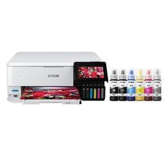 the epson printer is shown with all its inks in different colors and sizes