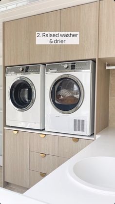 a washer and dryer in a bathroom next to each other