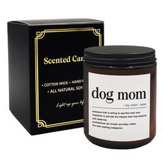 a jar of dog mom scented candle next to a box with the label on it