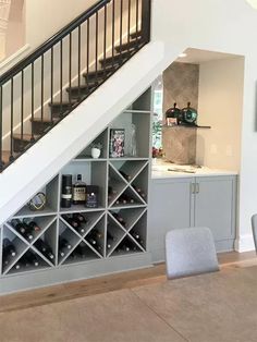 there is a wine rack under the stairs