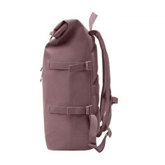 a pink backpack with straps on the front and side pockets, sitting against a white background