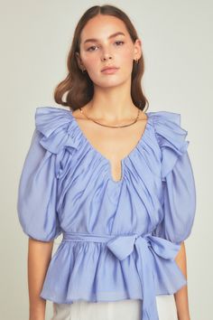 With puffy sleeves that are accented with ruffle detailing on the shoulders this top flows into a peplum hem. You can enhance the peplum silhouette with the included waist tie. Spring Capsule, Peplum Hem, Puffy Sleeves, Spring Wardrobe, Puff Sleeve Top, Sleeves (women), Top Sales, Powder Blue, Spring Collection