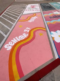 the sidewalk is painted with different colors and designs