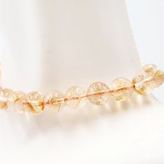 Embrace the Radiant Beauty of CitrineDiscover the captivating allure of the Citrine Bracelet. Adorned with 8mm citrine beads, this bracelet showcases the radiant and vibrant beauty of this gemstone. Each bead is carefully selected to exhibit the golden hues and sparkling clarity of citrine, creating a truly enchanting accessory that brings warmth and positivity to your look.Uplifting Energy and AbundanceCitrine is known as the stone of abundance and joy. It radiates positive energy, uplifts the Adjustable Citrine Gemstone Beads Crystal Bracelet, Citrine Natural Stones Beaded Bracelets, Citrine Gemstone Beads Crystal Bracelet, Citrine Gemstone Beaded Bracelets, Amber Citrine Crystal Bracelet With Round Beads, Amber Citrine Beaded Bracelets With Round Beads, Spiritual Citrine Round Bead Bracelets, Natural Stone Citrine Beaded Bracelets, Spiritual Citrine Crystal Bracelet With Gemstone Beads