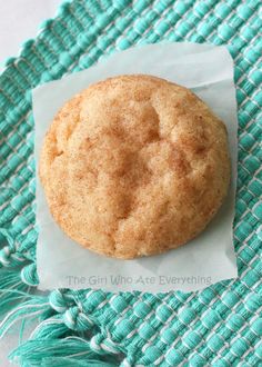 a cookie sitting on top of a blue place mat