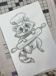 a drawing of a raccoon holding a baseball bat on top of a crossword puzzle