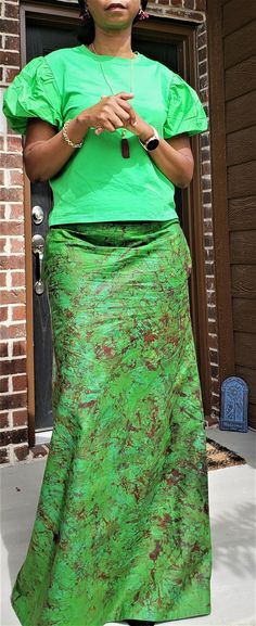 This A-line skirt in a beautiful Green and Wine tie-dye pattern is the perfect building block for your holiday outfit! The waist is elasticated and the skirt comes with pockets for max comfort. Dress it up or down for that special occasion. Medium - Waist 32 inches Hips 42 inches Large - SOLD OUT NOTE: Color and pattern variations may exist due to the nature of the production process. Green Silk Flowy Maxi Skirt, Womens Duster Coat, Adire Cloth, African Skirt, Styles Ankara, Skirt For Fall, Long A Line Skirt, Tie Dye Maxi Skirt, African Skirts