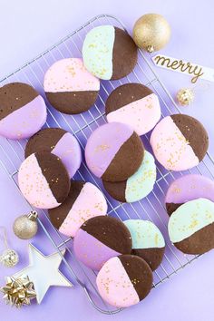 some cookies are sitting on a cooling rack next to a christmas or new year's decoration