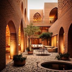 an indoor courtyard with seating and potted plants